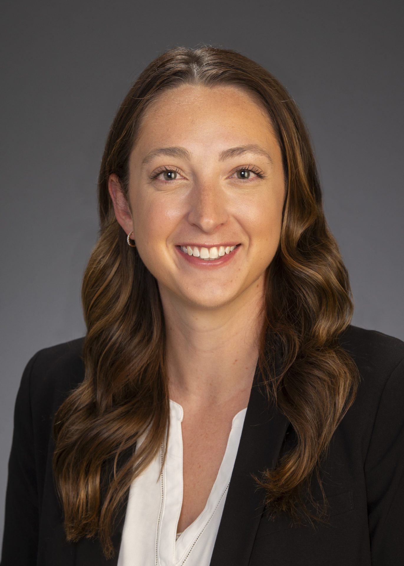 Graziadei McIlveen_Christina_5x7 Female attorney in black suit and white shirt