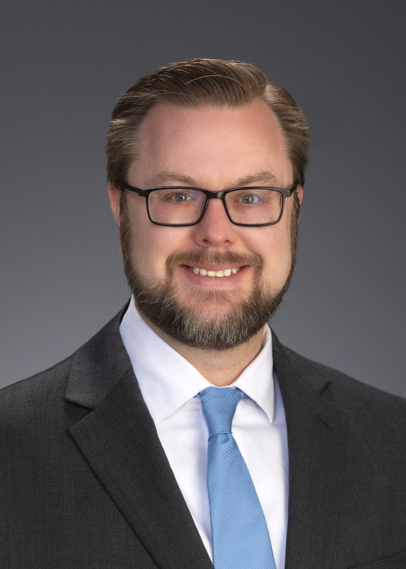 Wagenleitner_Ryan_5x7 Man in grey suit and blue tie.